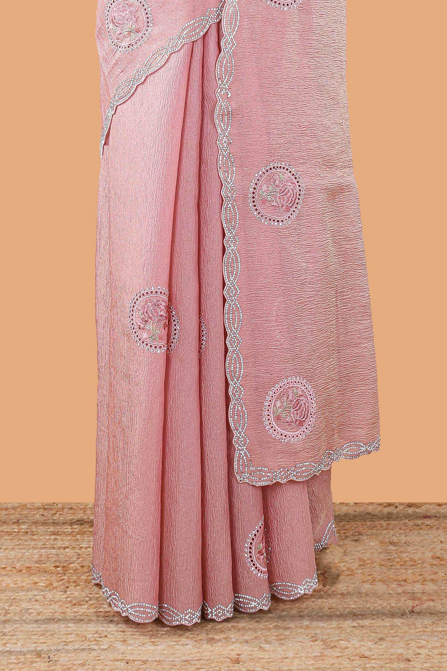 Pink organza crush saree with floral motif embroidery and stone work