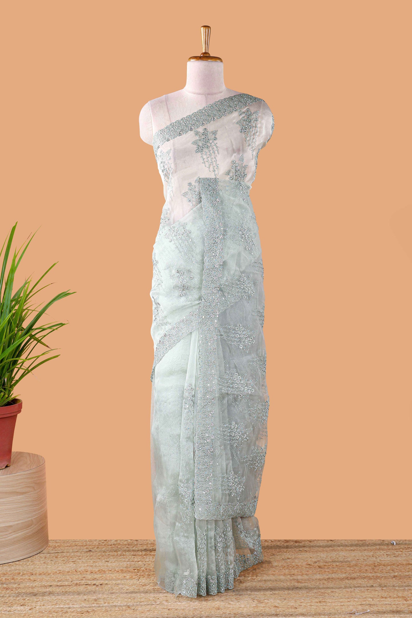 Green organza crush saree with floral embroidery and stone work