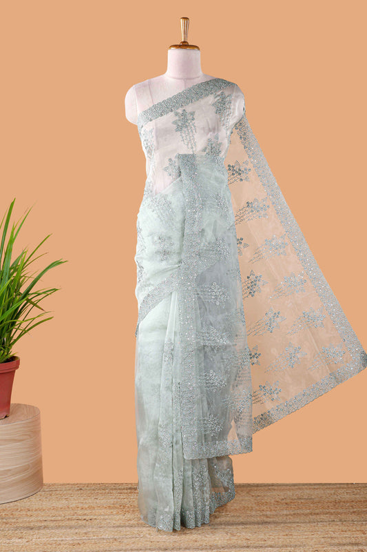 Green organza crush saree with floral embroidery and stone work