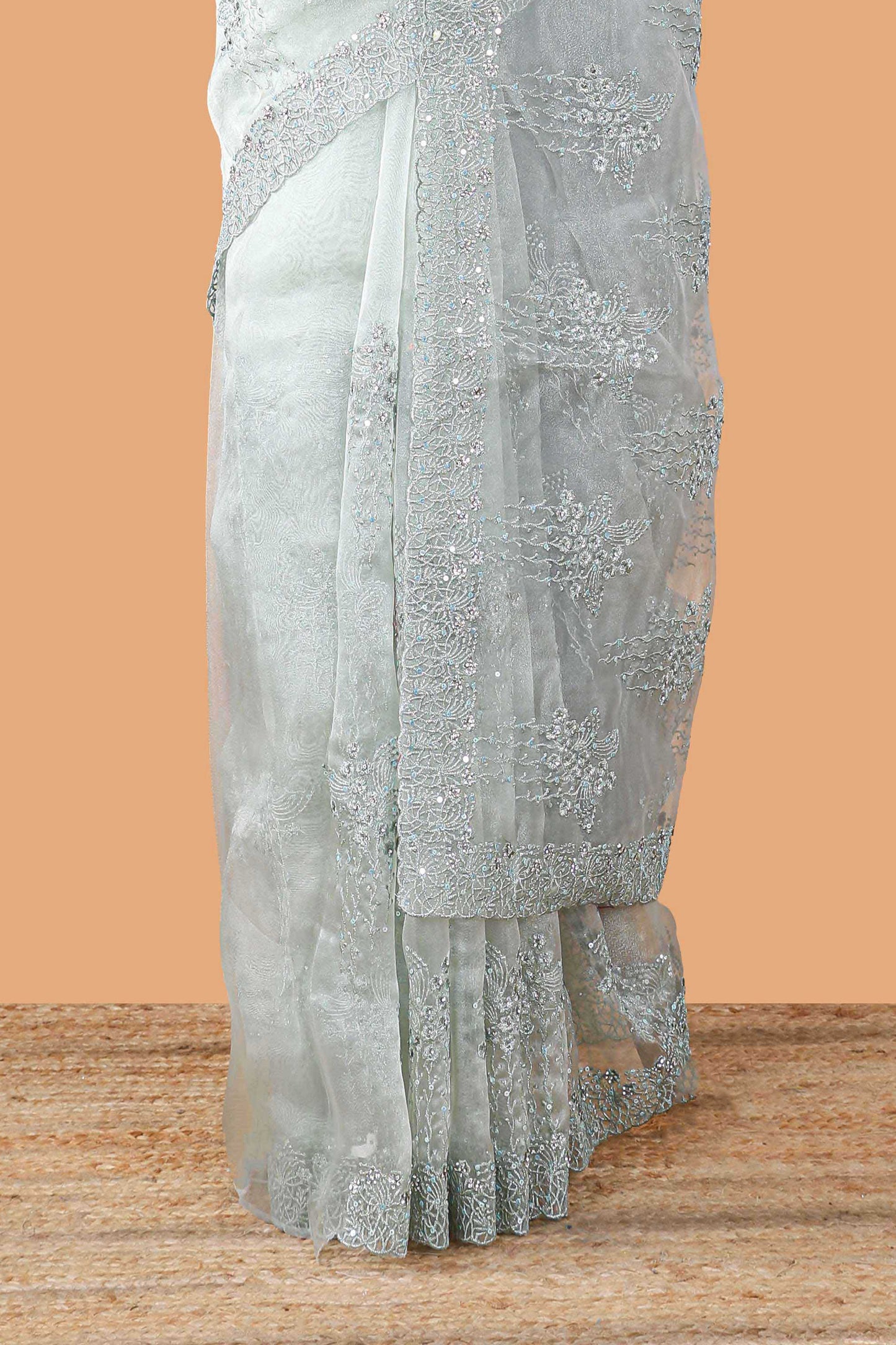 Green organza crush saree with floral embroidery and stone work