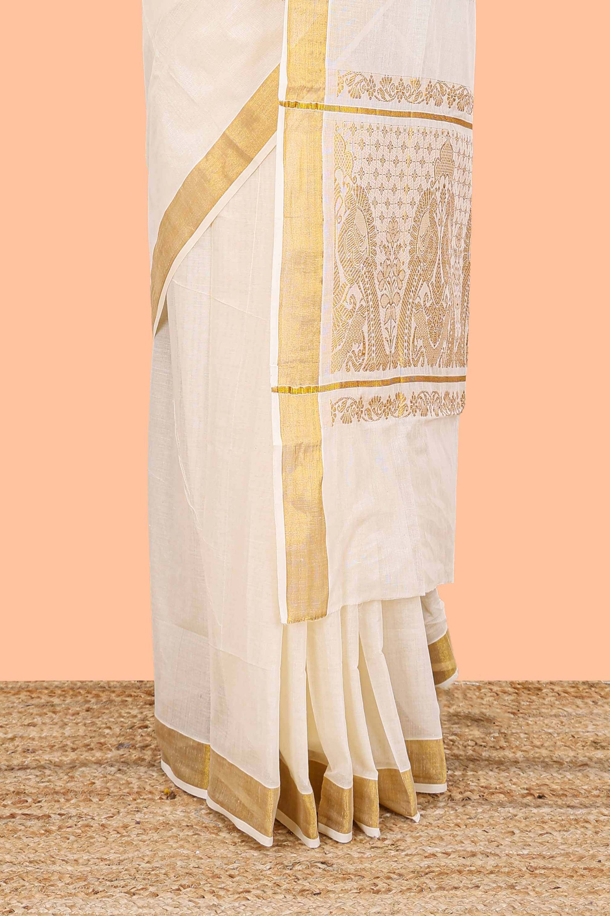 Cream peacock zari pallu saree