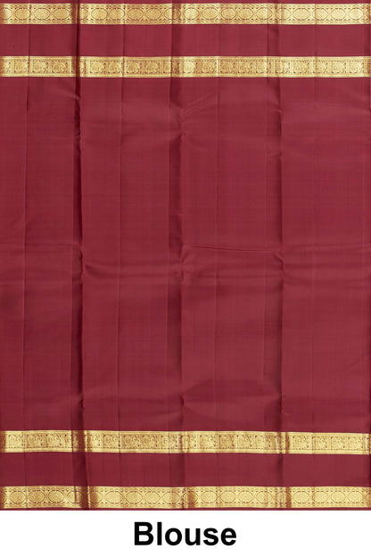 
Elegant rust orange Kanchipuram saree