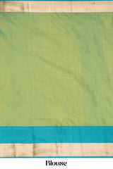 Green blouse with a blue border and beige bottom 