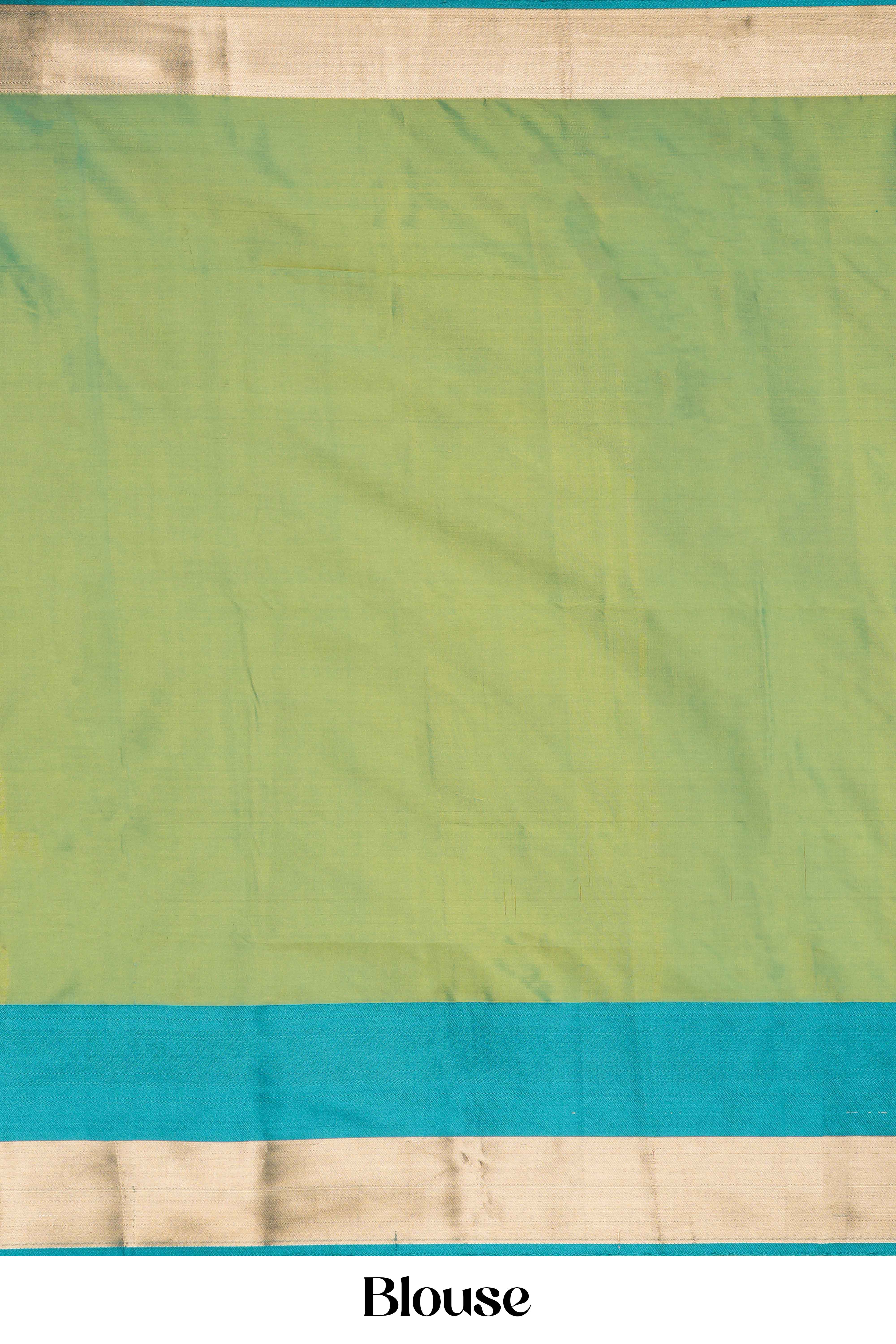 Green blouse with a blue border and beige bottom 