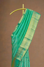 Green saree gold border