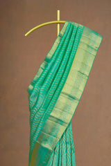 Green saree gold border