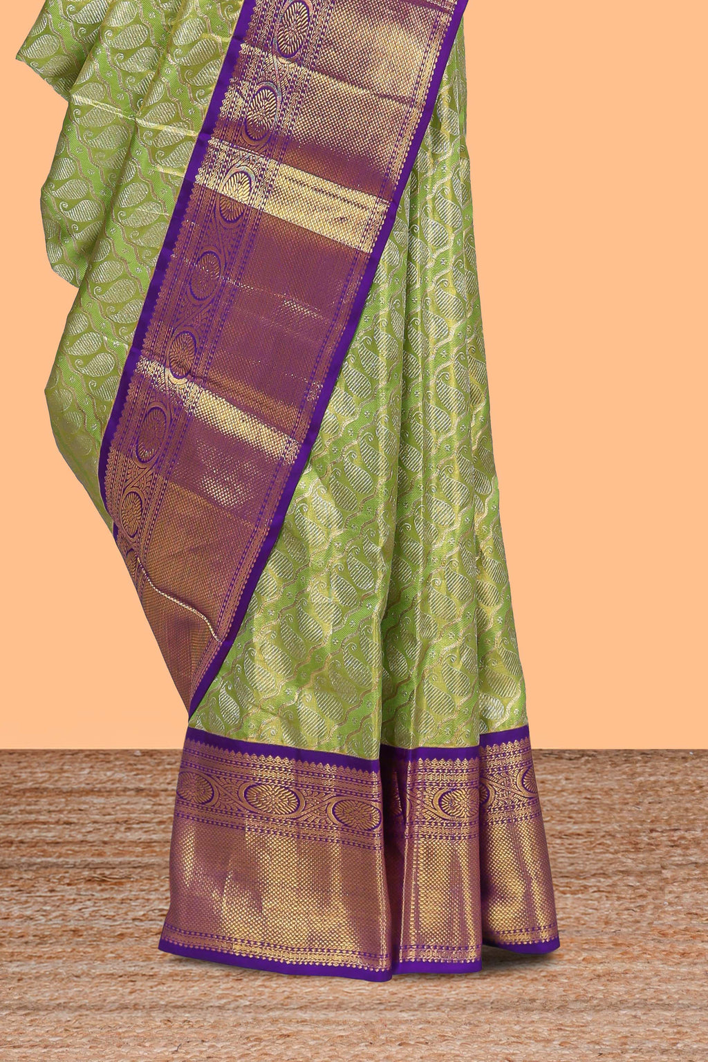 Parrot green paisley pattern Kanchipuram traditional silk saree with contrast zari border and zari pallu comes with blouse