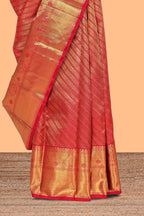 Red floral striped Kanchipuram wedding silk saree with self zari border and zari pallu comes with matching blouse
