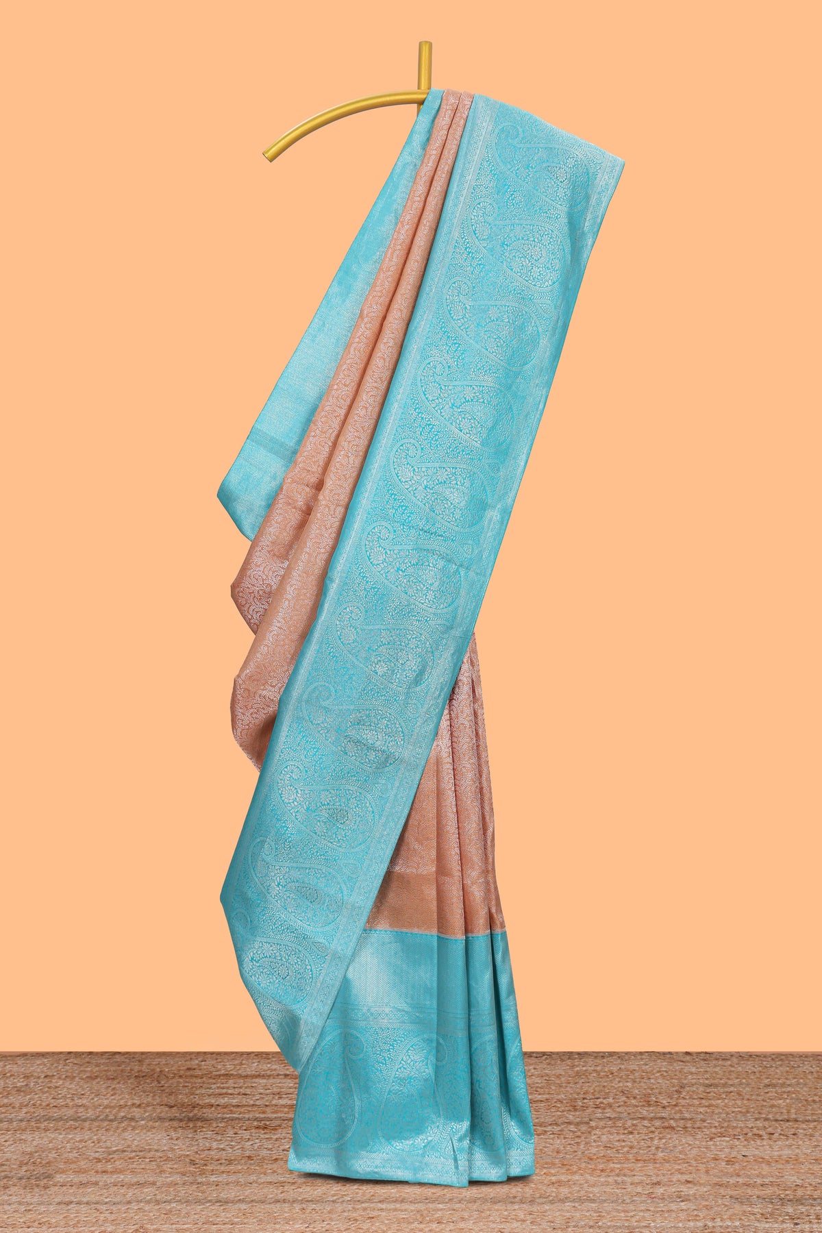 Dusty peach floral designed  Kanchipuram designer silk saree with contrast zari border and zari pallu comes with blouse