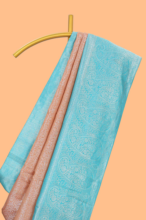 Dusty peach floral designed  Kanchipuram designer silk saree with contrast zari border and zari pallu comes with blouse