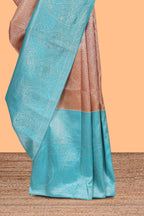 Dusty peach floral designed  Kanchipuram designer silk saree with contrast zari border and zari pallu comes with blouse