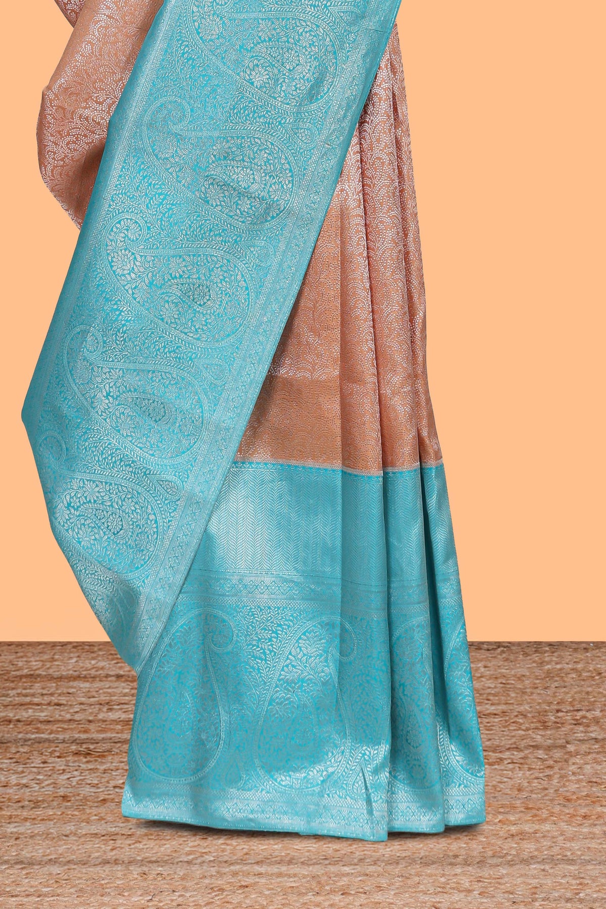 Dusty peach floral designed  Kanchipuram designer silk saree with contrast zari border and zari pallu comes with blouse