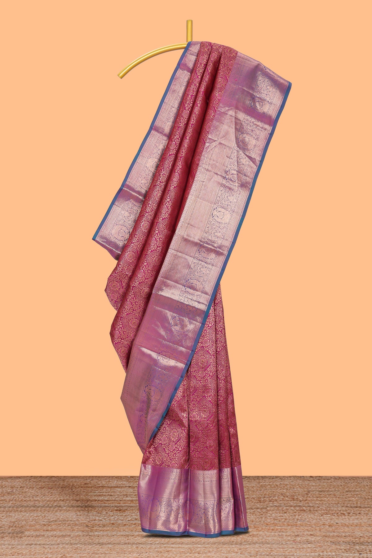 Magenta floral designed Kanchipuram silk saree with contrast zari border and zari work pallu comes with contrast blouse