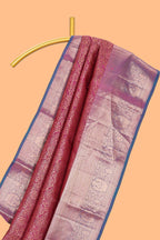 Magenta floral designed Kanchipuram silk saree with contrast zari border and zari work pallu comes with contrast blouse