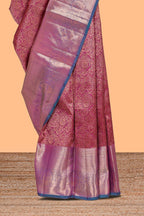 Magenta floral designed Kanchipuram silk saree with contrast zari border and zari work pallu comes with contrast blouse