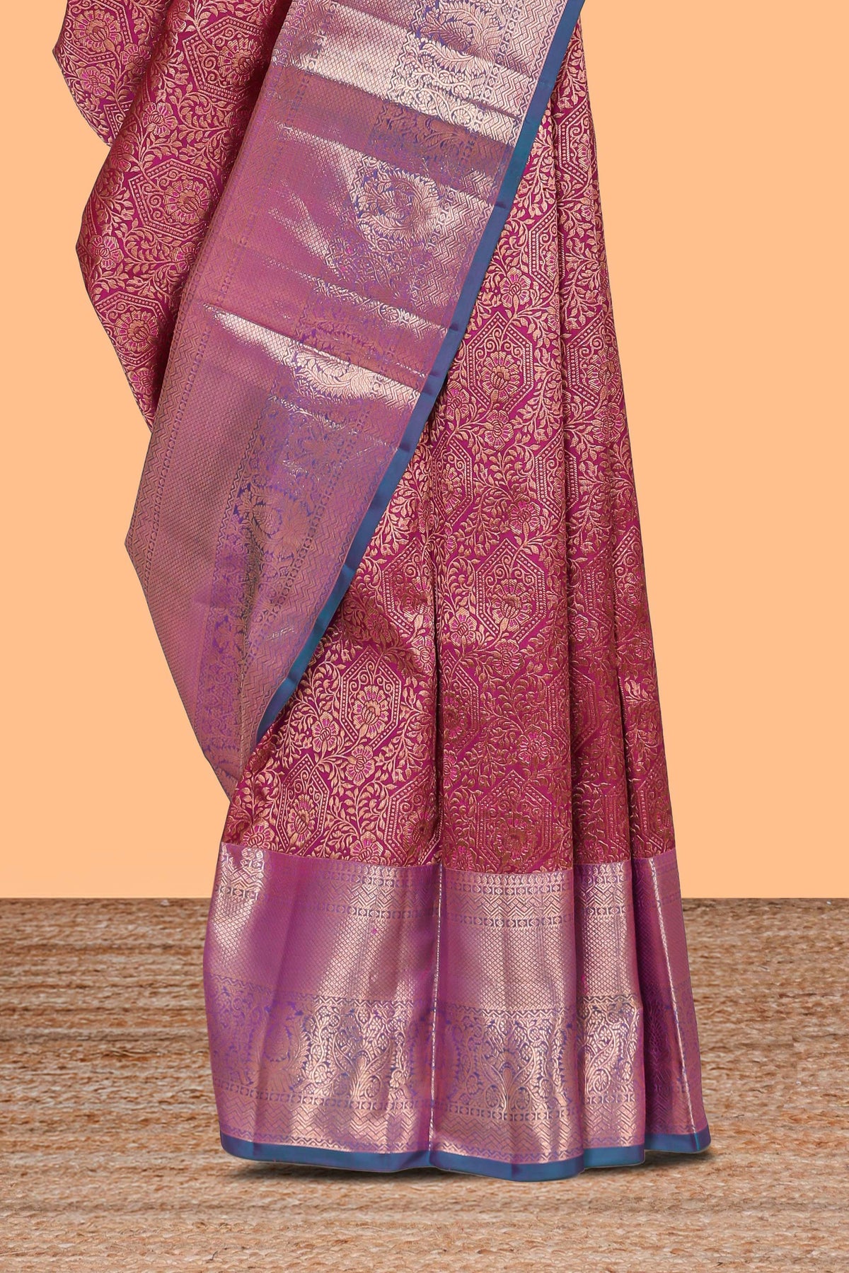 Magenta floral designed Kanchipuram silk saree with contrast zari border and zari work pallu comes with contrast blouse