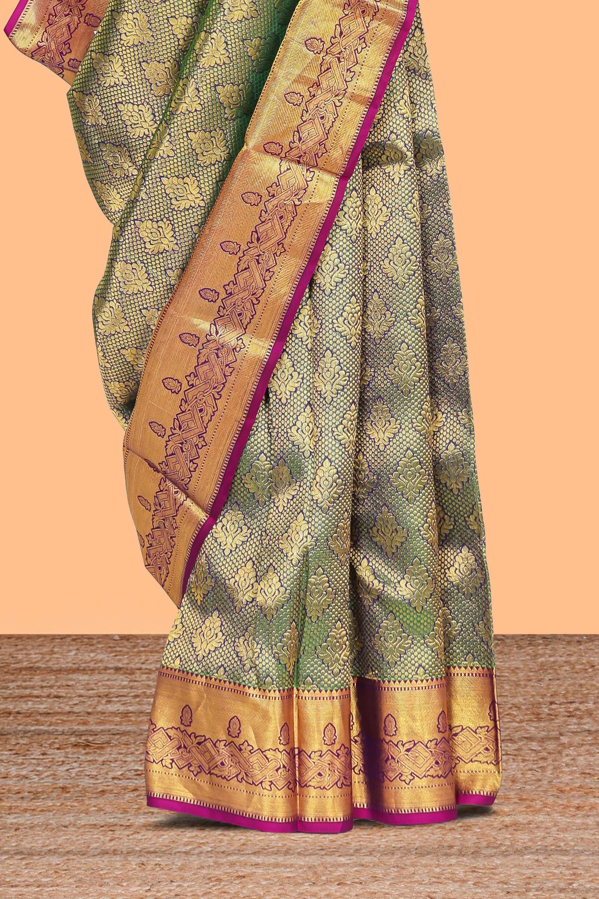 Green zari designed floral motifs Kanchipuram silk saree with contrast zari border and zari work pallu comes with contrast blouse