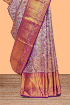 Violet zari floral designed Kanchipuram tissue silk saree with self zari border and zari work pallu comes with matching blouse