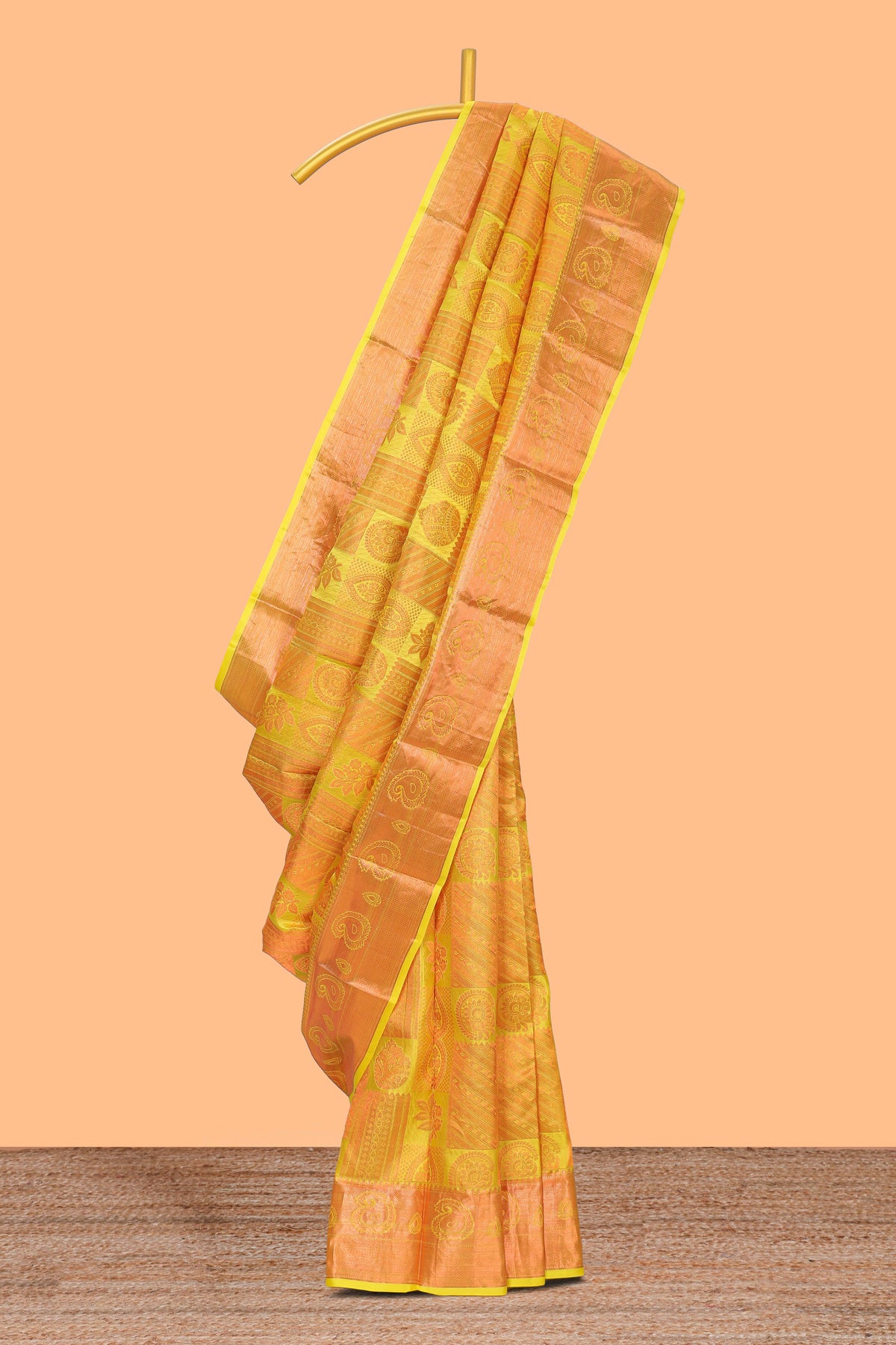 Yellow geometric and floral designed Kanchipuram designer silk saree with self zari border and zari work pallu comes with matching blouse