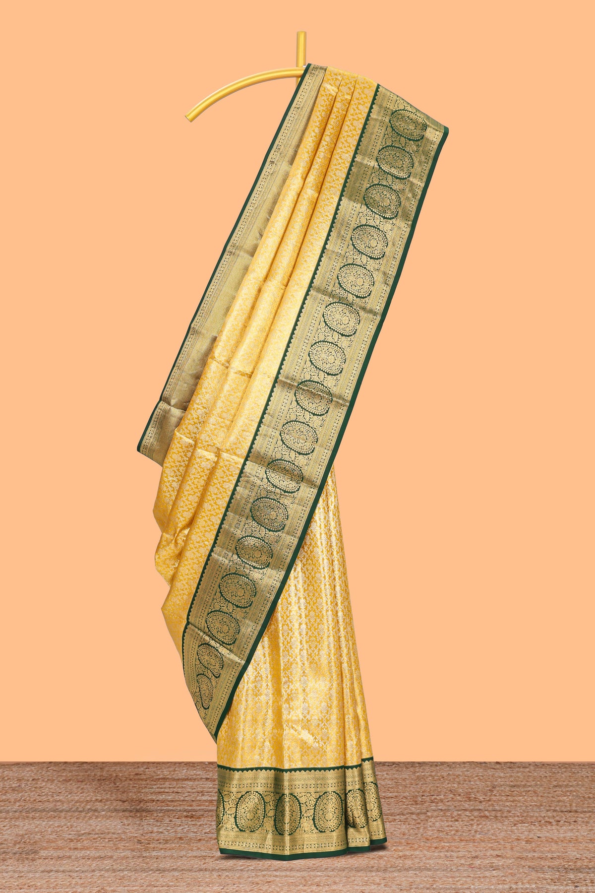 Yellow zari designed Kanchipuram traditional silk saree with contrast zari border and zari work pallu comes with blouse