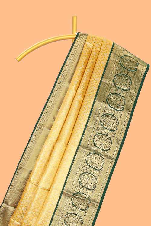 Yellow zari designed Kanchipuram traditional silk saree with contrast zari border and zari work pallu comes with blouse