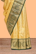 Yellow zari designed Kanchipuram traditional silk saree with contrast zari border and zari work pallu comes with blouse