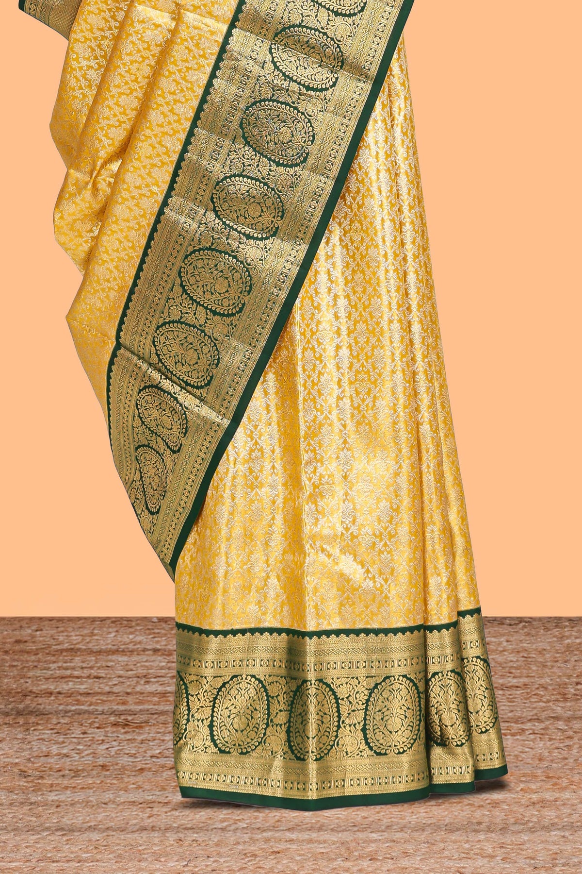 Yellow zari designed Kanchipuram traditional silk saree with contrast zari border and zari work pallu comes with blouse