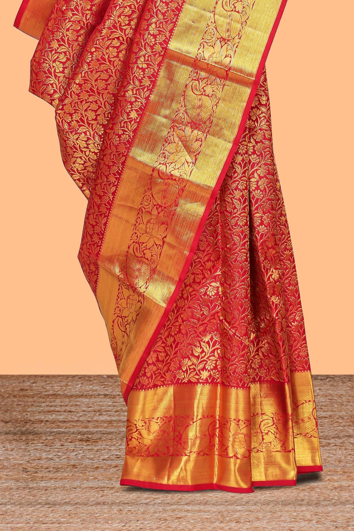 Red floral designed Kanchipuram wedding silk saree with self zari border and zari pallu comes with matching blouse