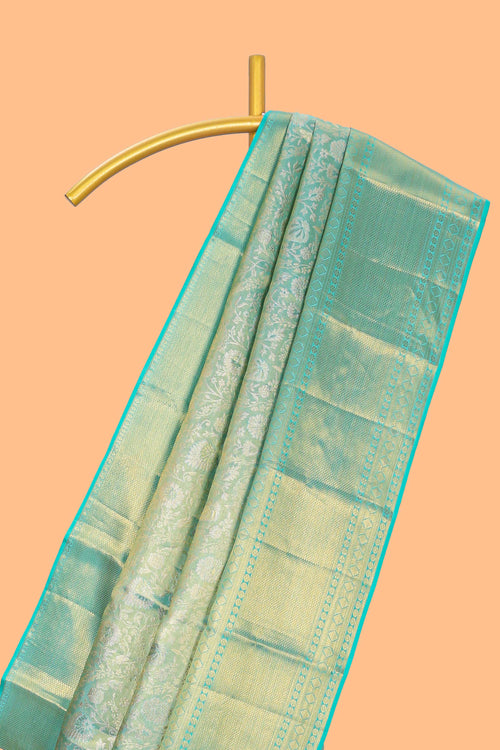Light sea green floral designed Kanchipuram tissue silk saree with self zari border and zari work pallu comes with matching blouse (Copy)