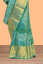 Green geometric and butta designed Kanchipuram vairaooi and checks silk saree with self zari border and zari work pallu comes with matching blouse