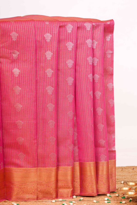 Kota with woven silver zari floral motifs arranged vertically across the body 