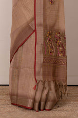 Orange linen saree with French knot work