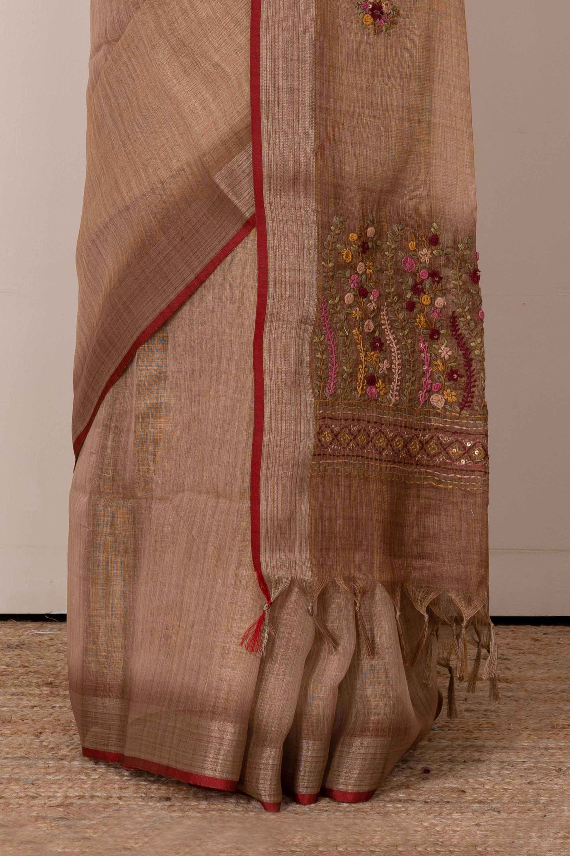 Orange linen saree with French knot work