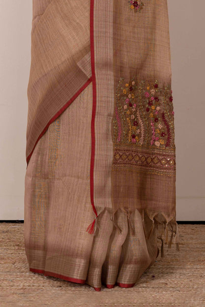 Orange linen saree with French knot work