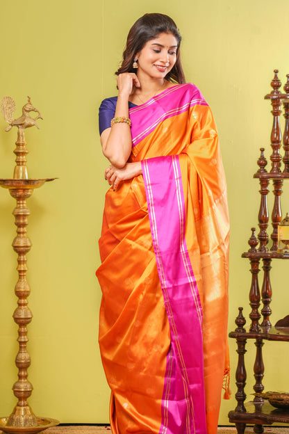 Orange semi soft silk contrast border saree