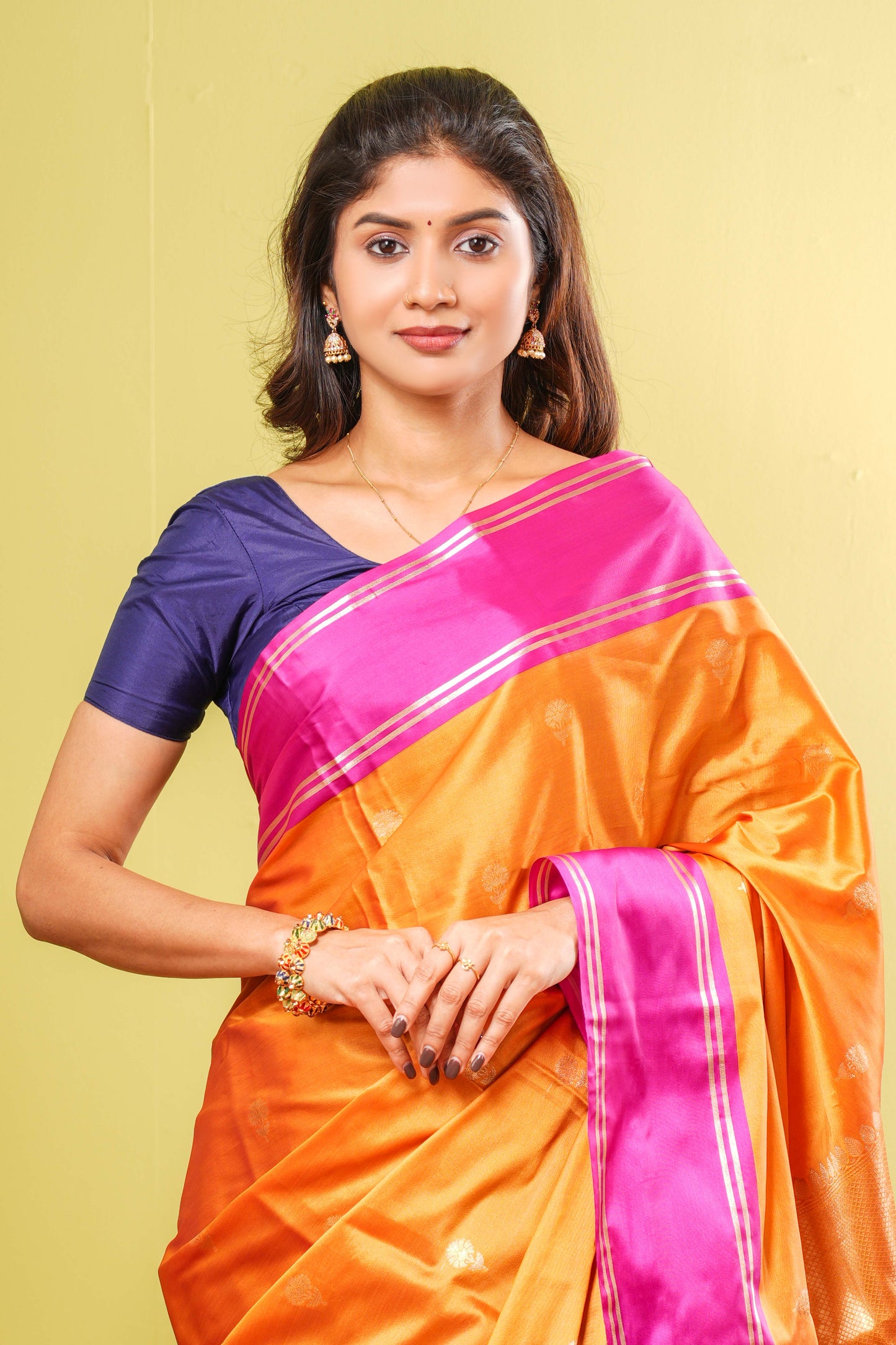 Orange semi soft silk woven border saree
