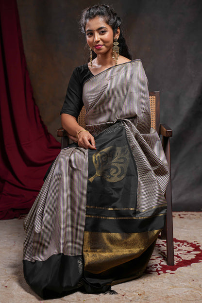 Multi color checked parambariya pattu saree with contrast leaf zari border and golden zari pallu