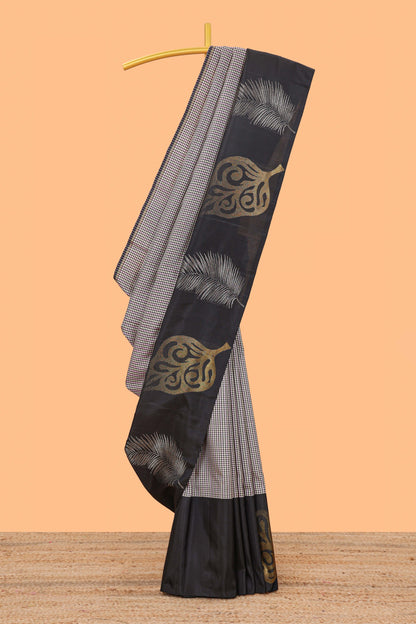 Multi color checked parambariya pattu saree with contrast leaf zari border and golden zari pallu