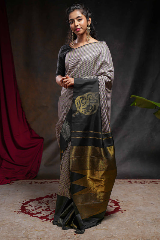 Multi color checked parambariya pattu saree with contrast leaf zari border and golden zari pallu