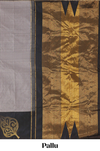 Multi color checked parambariya pattu saree with contrast leaf zari border and golden zari pallu