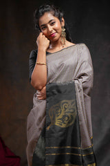 Multi color checked parambariya pattu saree with contrast leaf zari border and golden zari pallu