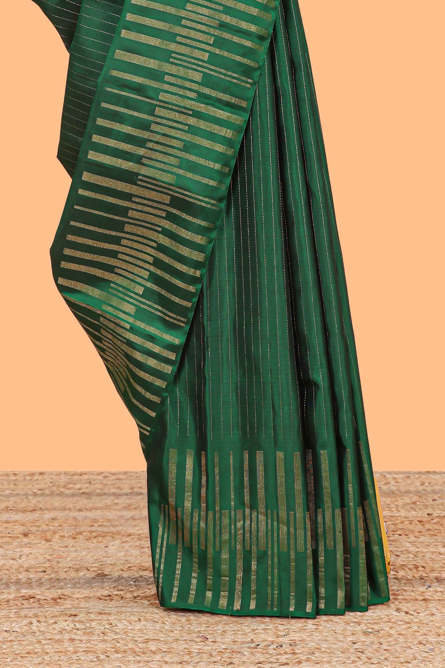 Borderless green parambariya pattu saree with zari stripes and matching checked zari pallu