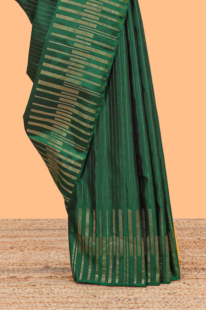 Borderless green parambariya pattu saree with zari stripes and matching checked zari pallu