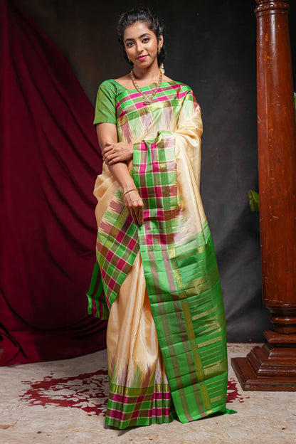 Sandal plain parambariya pattu saree with contrast checked ikkat style border and zari striped pallu