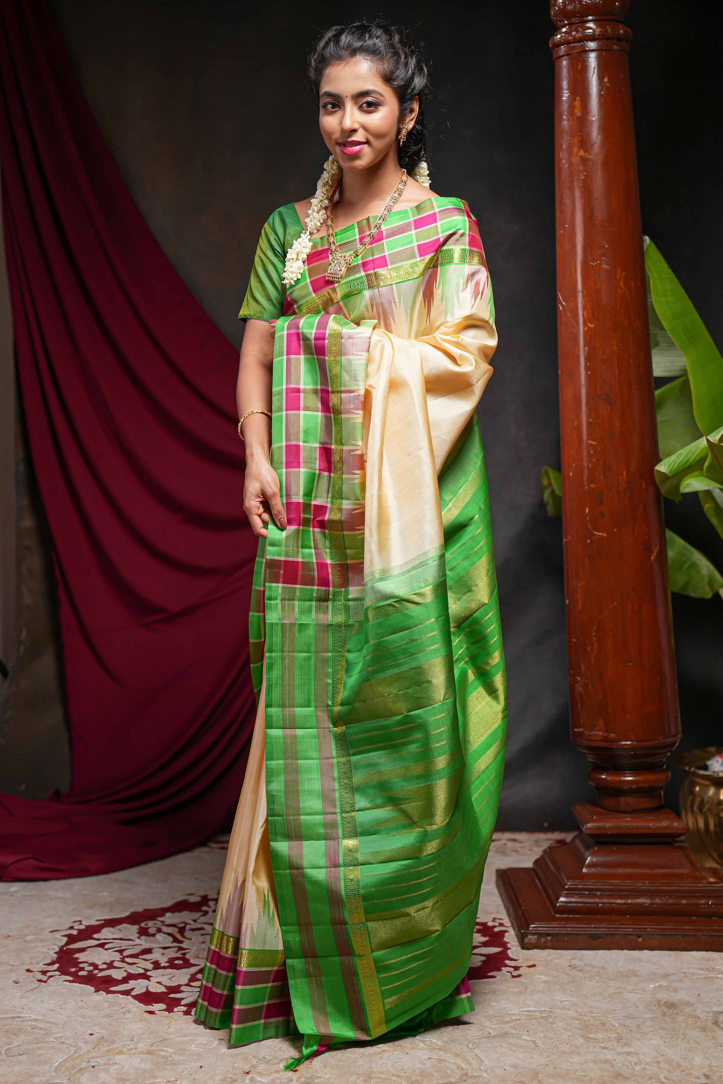 Sandal plain parambariya pattu saree with contrast checked ikkat style border and zari striped pallu