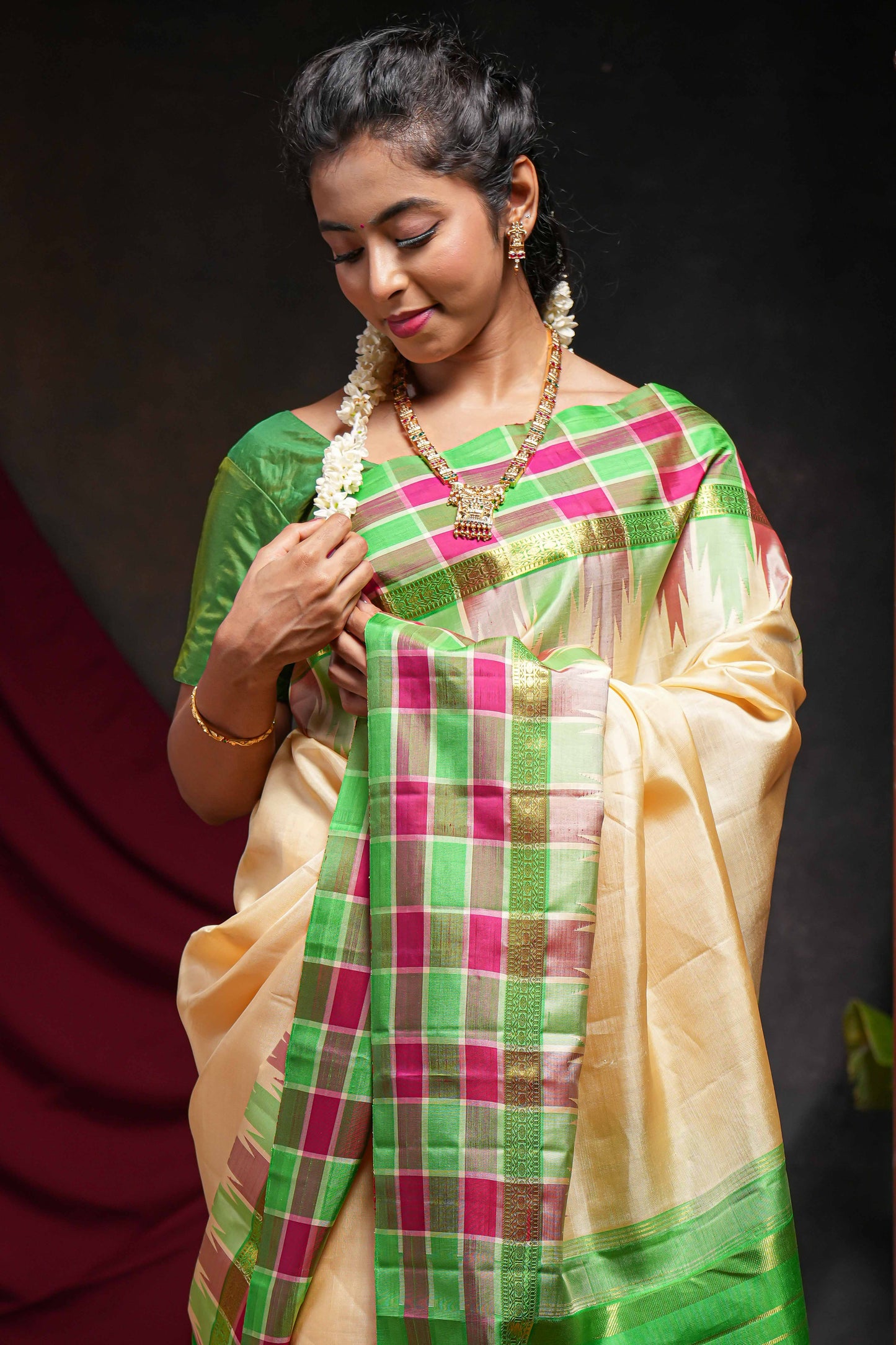 Sandal plain parambariya pattu saree with contrast checked ikkat style border and zari striped pallu