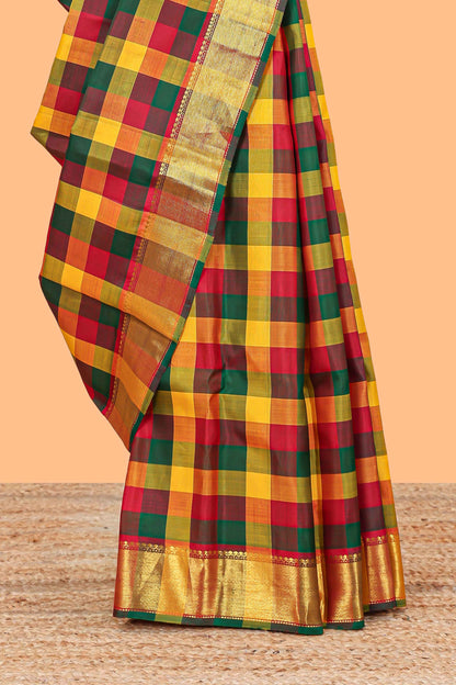 Multi color checked parambariya pattu saree with self zari border and contrast striped pallu