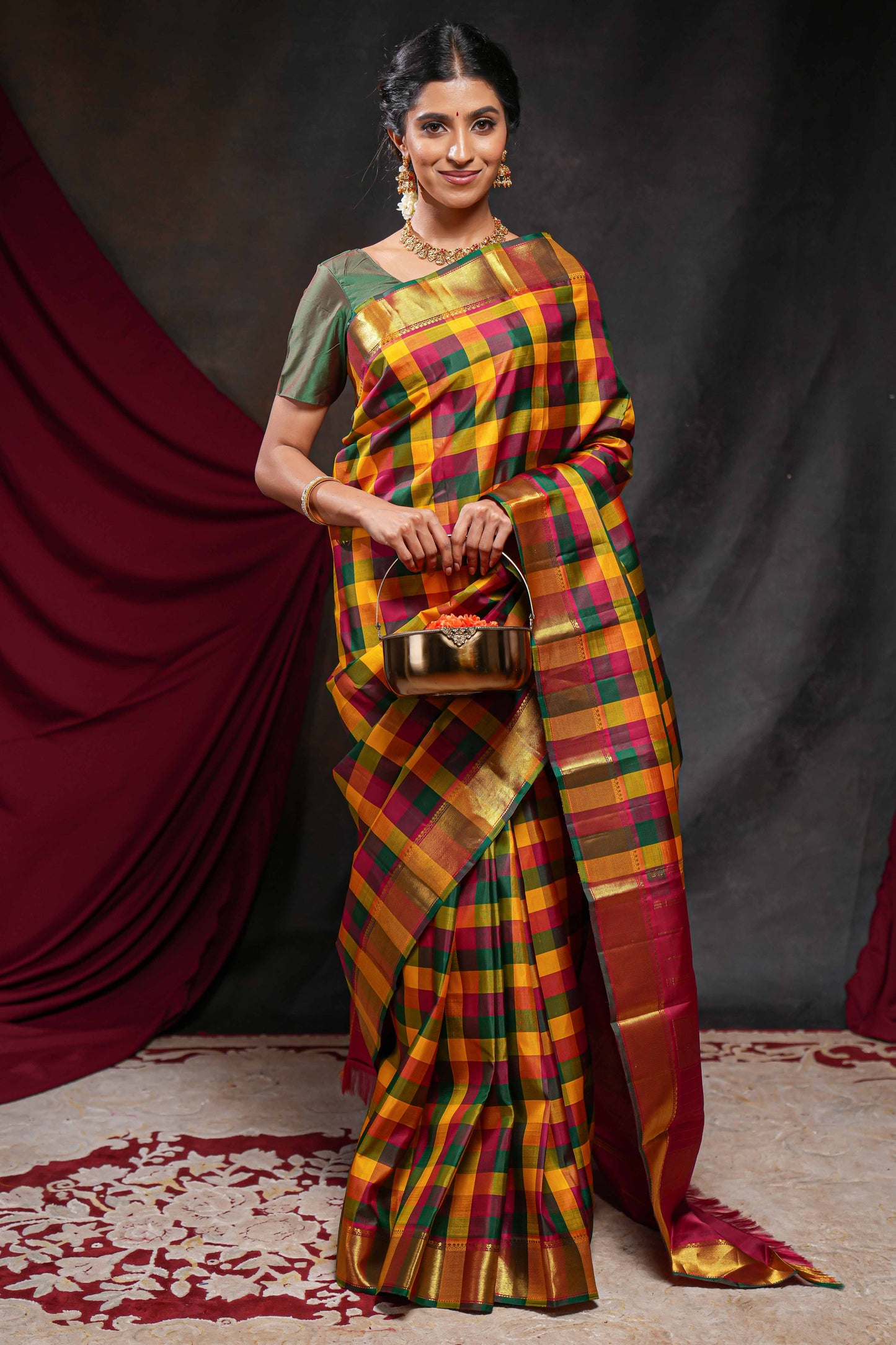 Multi color checked parambariya pattu saree with self zari border and contrast striped pallu