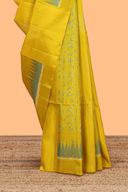 Lemon yellow parambariya pattu saree with self zari border and contrast blouse