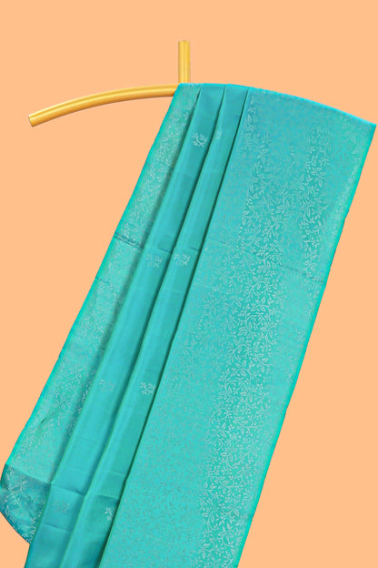 Borderless turquoise green zari stripes and butta parambariya pattu saree with self pallu and matching blouse